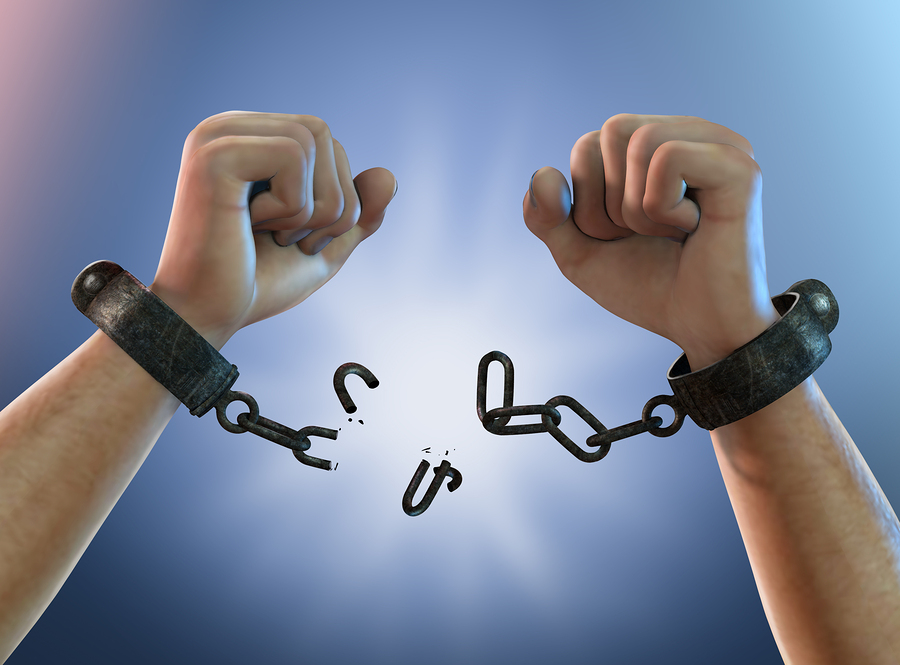 Breaking Free — A Man Breaking Chains