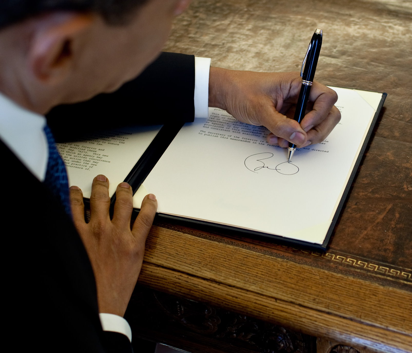 Obama signing an executive order